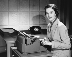 Woman typing on type writer